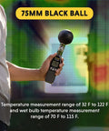 Person holding Pro Grade Heat Index Monitor with Wet Bulb Globe Temperature Gauge and Brass Ball, 75mm black ball visible.