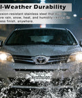 Front view of a car in rain showcasing Glitzy License Plate Frame Set For Women on stainless steel with black finish.