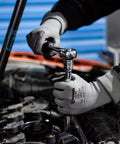 Person using wrench while wearing Smart Touch Work Gloves With Nitrile Grip Palm, 60 Pairs, 3D Comfort Stretch, Size Large