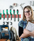 Red Wall Mount Screwdriver And Pliers Organizer Rack With 23 Holes mounted on wall with tools and smiling person