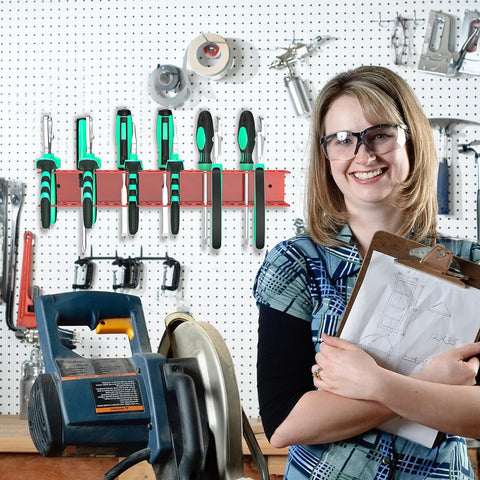 Red Wall Mount Screwdriver And Pliers Organizer Rack With 23 Holes mounted on wall with tools and smiling person