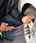 Person using Bayonet Style Tire Inflator Gauge With 12 Inch Heavy Duty Air Hose And Straight Head Chuck on car tire