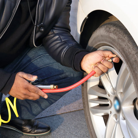 Person using Bayonet Style Tire Inflator Gauge With 12 Inch Heavy Duty Air Hose And Straight Head Chuck on car tire