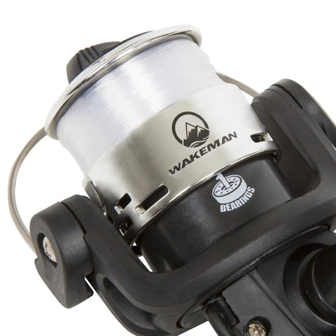 Close-up of the reel on a Portable 65 Inch Fiberglass Spinning Rod And Size 20 Reel Combo Two Piece Medium Action for bass fishing.