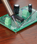 Close-up of soldering on 40 Pack Prototyping Printed Circuit Boards Kit With Five Size Universal Perforated Solderable Proto Boards For DIY