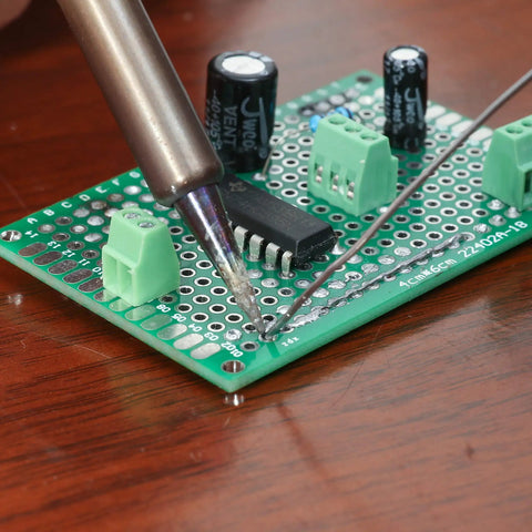 Close-up of soldering on 40 Pack Prototyping Printed Circuit Boards Kit With Five Size Universal Perforated Solderable Proto Boards For DIY