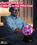Person enjoying the glow of a 6 Inch Plasma Ball Light With Touch And Sound Activation Lightning Globe for home desk fun.