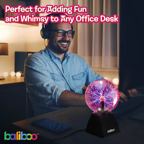 Person enjoying the glow of a 6 Inch Plasma Ball Light With Touch And Sound Activation Lightning Globe for home desk fun.