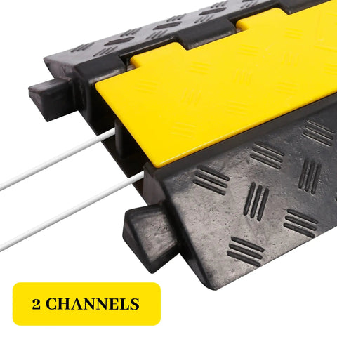 Close-up of a Two Channel Rubber Cable Ramp Protector and Cord Cover showing black and yellow channels with cables passing through.