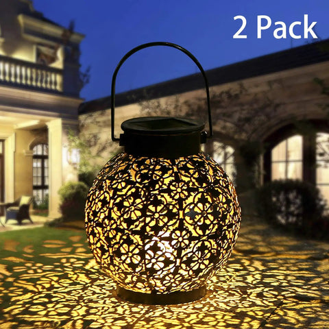 Outdoor Solar Lanterns Hanging Lights For Patio Porch Backyard Decorative Garden Lamps Metal Waterproof LED Lanterns With Auto On Off No Fuss Easy Setup Create Charming Shadow Patterns Two Pack showing floral shadow pattern at night