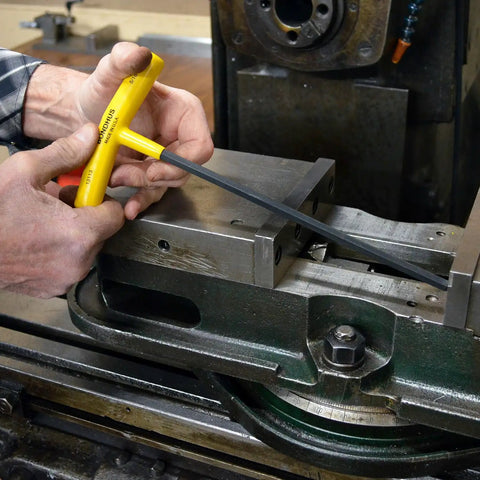 Using Set Of 10 Balldriver And Hex T Handles With Stand For 3/32 To 3/8 Inch in a machine shop setting, highlighting ergonomic grip and steel build