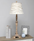 Antique Style Buffet Table Lamp With Cream Ruched Shade, Resin Base In Antique Cream Finish, displayed on wooden console table.
