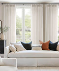 Pinch Pleated Linen Sheer Curtains 102 Inch Long, Two Panel Set With Ring Hooks And Clips For Track System in a living room setting.
