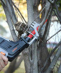 10-piece reciprocating saw blade set mounted on cordless saw, 6–8 inch wood/metal blades cutting a tree branch.