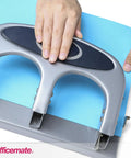 Person using Deluxe 3 Hole Punch With Chip Drawer Heavy Duty Paper Punch Delivers Clean 45 Sheet Capacity Ergonomic Padded Handle Desk Workhorse
