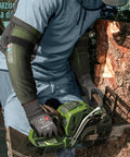 Man using chainsaw wearing Cut Resistant Arm Sleeves ANSI A9 For Men And Women With Puncture Protection, UPF50 Plus UV Blocking Cooling Sleeves