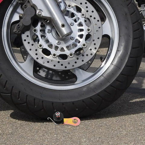 Get Your Off-Road Ride Rocking Hard With This Adjustable Metal Motorcycle Chain Tensioner Roller Guide Kit Perfect For Dirt Bikes Atv Sand Rails And Four Wheelers To Keep That Chain Tight And Boost Performance Big Time. black metal chain tensioner roller beside motorcycle front wheel