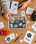 Person using 40-Piece Magnetic Sheets For Dies Storage With Rubber Magnet Sheets, surrounded by crafting materials on a wooden table.
