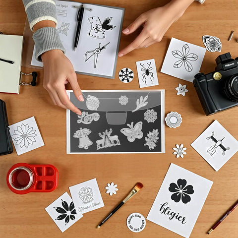 Person using 40-Piece Magnetic Sheets For Dies Storage With Rubber Magnet Sheets, surrounded by crafting materials on a wooden table.