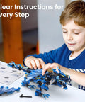 Dragon Building Kit With Remote Control For Kids 8-12 Hands On STEM Toy That Sparks Imagination Build Code And Play With A Dope Flying Dragon Ideal Gift For Birthday Or Holiday, child building blue plastic dragon with instructions
