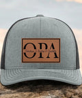 Personalized Papaw Hat From Kids Custom Fathers Day Gift Black And Gray Richardson 112 Trucker Cap With Leather Patch And Established Year For That Papaw Style showing front view