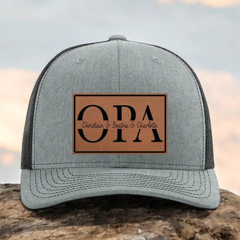 Personalized Papaw Hat From Kids Custom Fathers Day Gift Black And Gray Richardson 112 Trucker Cap With Leather Patch And Established Year For That Papaw Style showing front view
