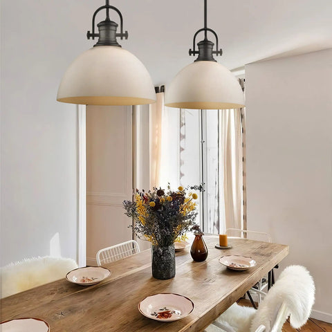 Dining area with Hines Pendant Light In Rubbed Bronze With Seeded Glass Transitional Ceiling Fixture over wooden table