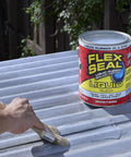 Hand applying Liquid Rubber Coating Sealant For Waterproof, Flexible, UV Resistant Protection on metal roof, 1 gallon can.