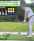 Golfer using oversized 6x4ft golf hitting mat with built-in ball tray and dual turf in outdoor setting