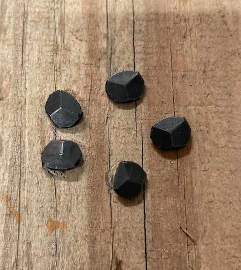 1 Inch Wrought Rose Head Nails Set Old School Hand Forged Antique Style Nails With Black Oxide Finish 25 Count For Restoration Projects And Vintage Furniture Decorative Hardware on wooden surface.