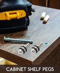 Close-up of 20 Pack Self Tapping Shelf Pegs For Cabinets And Bookcases, Cold Rolled Steel, Heavy Duty Load Bearing, drill on wood surface