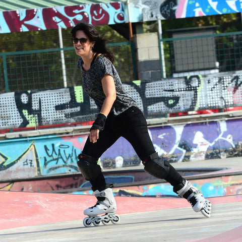 Woman skating at a park wearing TC Inline Skates for Adults and Teens, Pro Roller Blades for Men and Women, fitness and recreation skates in grey.