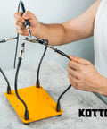 Person using Four Arm Gooseneck Helping Hands Soldering Stand With Steel Weighted Non Slip Base For PCB Work