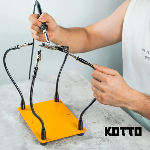 Person using Four Arm Gooseneck Helping Hands Soldering Stand With Steel Weighted Non Slip Base For PCB Work