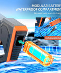 Close-up of black electric water gun with an orange modular rechargeable battery on a poolside. Electric Water Gun For Adults And Kids Auto Filling Squirt Gun With Long Range Epic Power Large Capacity Water Blaster For Summer Pool Beach Parties Great Gift For 6 7 8 Year Old Boys And Girls Black