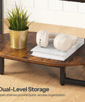 Oval Wood Coffee Table With Dual Open Storage Shelves Chill Farmhouse Vibe For Cozy Living Rooms And Home Offices Rustic Brown Finish showing dual-level storage with headphones and plant.