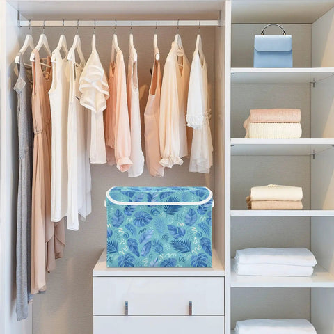 Sturdy Collapsible Storage Bin With Flip Top Lid And Easy Grip Handles For Bedroom Organization 300d Oxford Fabric Foldable Closet Box With Secure Velcro Closure in a closet with hanging dresses.