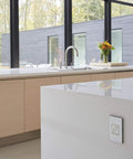 Modern kitchen showing Tamper-Resistant Self-Test GFCI Outlet 15A White Finish With Matching Wall Plate, seamless design