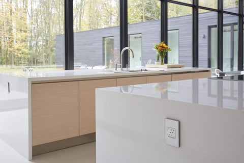 Modern kitchen showing Tamper-Resistant Self-Test GFCI Outlet 15A White Finish With Matching Wall Plate, seamless design
