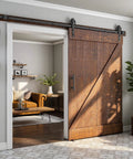 Built Like A Tank 7 Foot Sliding Barn Door Hardware Kit Featuring Heavy Duty Steel Tracks mounted on a rustic barn door.