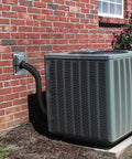 Tough As Nails Hvac Wall Penetration Cover And 3 Layer Insulated Line Set Sleeve Kit on AC condenser piping near brick wall.