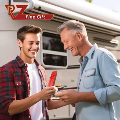 Two people exchanging a red gift in front of an RV, symbolizing a special occasion while camping.