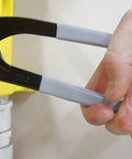 Wide Opening Pipe Pliers With Soft Jaw And Interchangeable Round And Square Jaws, 14 Inch Length, held gripping a yellow pipe