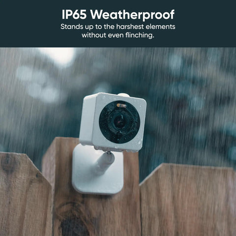 1080p Indoor Outdoor Security Camera With Color Night Vision Built In Spotlight Motion Detection Two Way Audio Wi Fi Alexa And Google Compatible Free Expert Setup White on a fence in rain