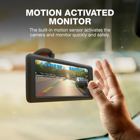 Person using Six Inch HD Dashboard Monitor with Solar Powered Wireless Back Up Cam, showing motion sensor activation.