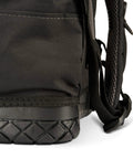Close-up of waterproof base detail on heavy duty tool backpack in veil camo tac grey for tradesmen and DIYers.