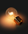 Cordless USB Rechargeable LED Light Bulb Lamp With Vintage Edison Glow Portable Bedside Night Light on dark background