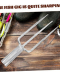 Three Prong Metal Garden Fork For Gardening And Fishing Heavy Duty All Purpose Tool on wooden surface with fishing gear