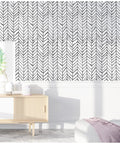 Room showcasing peel and stick black and white herringbone wallpaper with self adhesive vinyl decor easy install no mess durable and removable