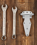 Heavy Duty Freezer Door Hinge Zinc Alloy with wrenches on wooden background
